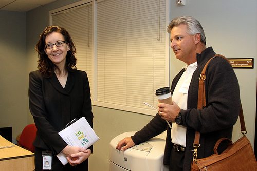 small business resource - photo of two people standing in an office