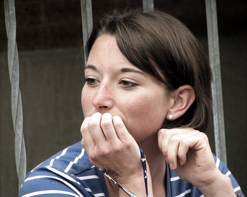 photo of woman pondering - how to be more curious